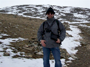 Photo of Pete in outdoor gear in antartic like terrain