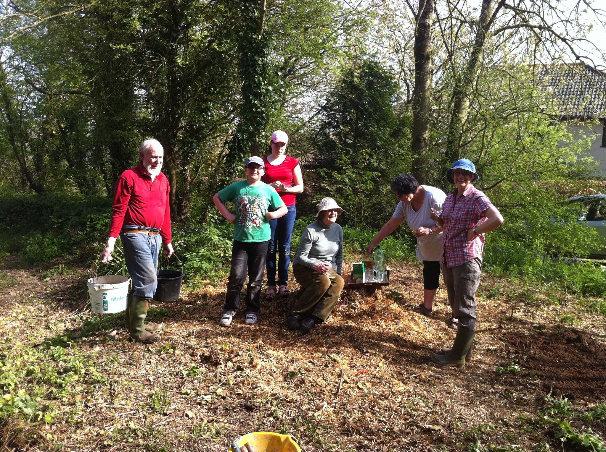 Volunteers stop for cider whilst cl;earing the pond