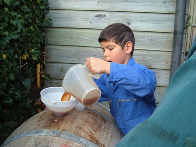 Apprentice Thomas tops up the hogshead