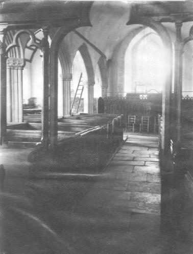 Interior looking west and showing a small portion of the modern Chancel screen in the foreground