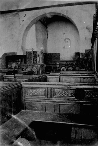 Interior looking north showing a square pew and the North Transept.
